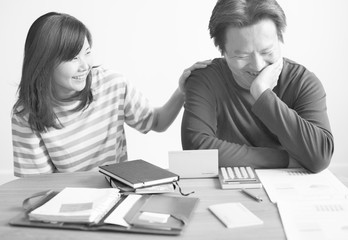 Canvas Print - Asian couple planning for the investment