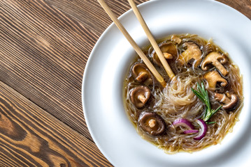 Sticker - Portion of shiitake ginger soup on the wooden table