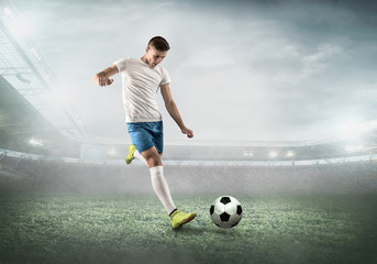 Soccer player on a football field in dynamic action at summer da