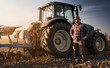Farmer working during the tractor plowing fields -preparing land for sowing in autumn