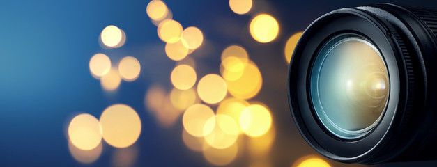 camera lens with bokeh lights background