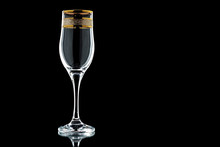 Glass Of Wine With A Gold Rim  On A Black Background (isolate).