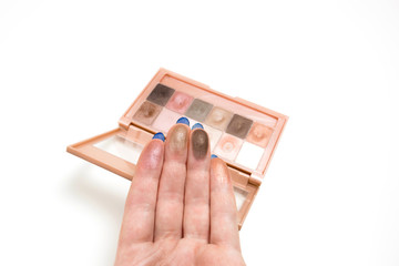 Sticker - Swatches of palette eyeshadows on a female hand. White background