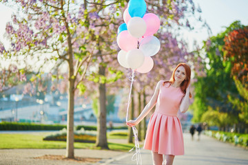 Wall Mural - Girl with bunch of balloons in Paris