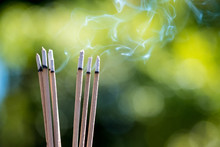 Burning Embossed  Sticks And Smoke From Incense Burning And Smoke