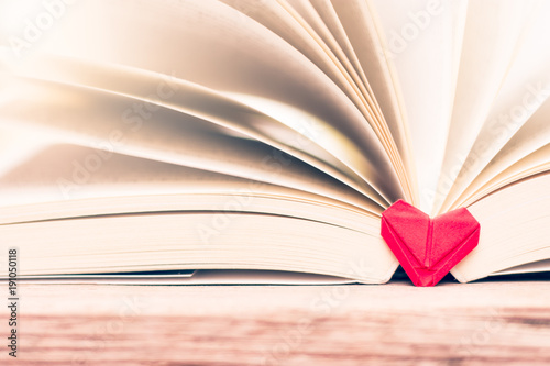 Fold The Paper Into A Heart Shape With The Book Lying On The