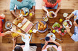 © Syda Productions - group of people having breakfast at table