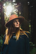 © Kike Arnaiz/ADDICTIVE STOCK - Young woman standing in forest