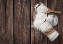 Jar Of Baking Soda With Text Space On Wood Background,top View