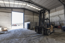 Forklift In Warehouse Waiting For Work