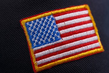 us flag patch on black background, close up