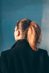 Wall Mural - Beautiful girl with red hair in a coat