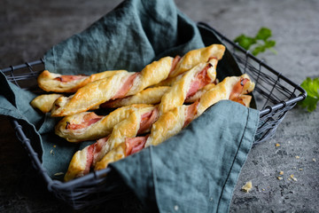 Wall Mural - Twisted puff pastry sticks with bacon