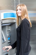 © Adam Gregor - Woman at the ATM