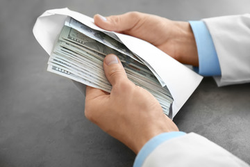 Poster - Doctor with bribe at workplace, closeup