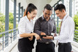 © PhotoJuthamat - Start up business. people team work meeting point to discuss the graph up and down of economy and work on tablet.Selective Focus