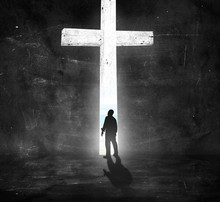 Good Friday Concept: Silhouette People Standing Over White Cross On Dark Room Background