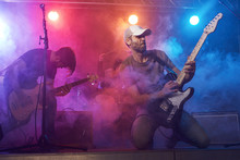 Guitarist And Bass Player Perform On Stage.