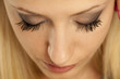 female eye with badly-applied mascara