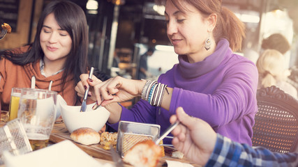 Friends having lunch in restaurant