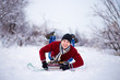 © Svetlana - Cheerful young man having fun on a sleigh in snowy weather