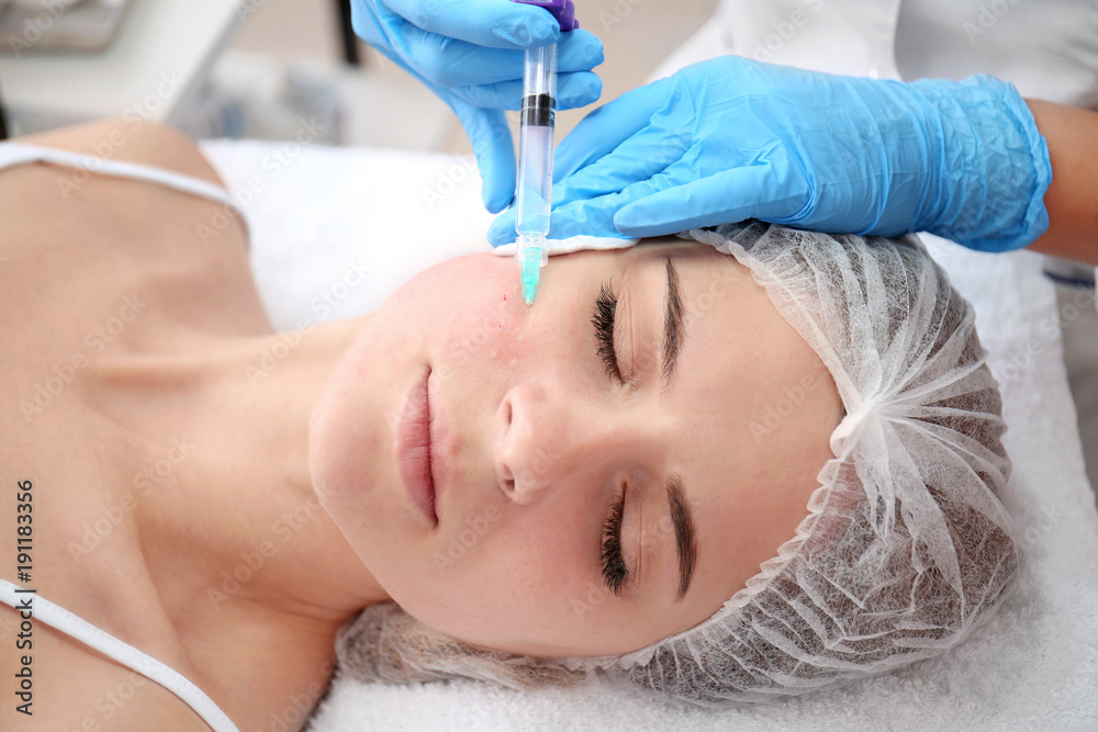 Beautician making injection in woman's face, closeup. Biorevitalization procedure