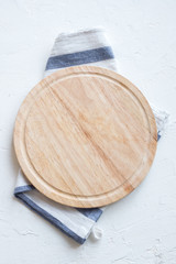 Wall Mural - Empty wooden platter on white table