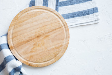 Empty wooden platter on white table