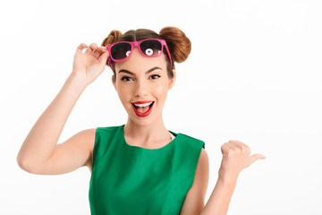 Wall Mural - Portrait of a smiling young girl dressed in green dress