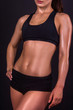 © syhin_stas - Figure of a sports girl on a black background