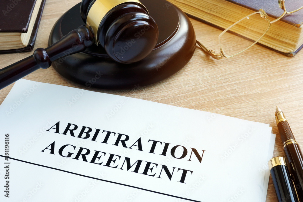 Arbitration agreement resolution of commercial disputes on a desk. - obrazy, fototapety, plakaty 