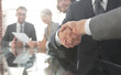 © ASDF - handshake of business partners in conference room