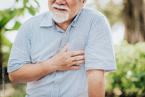 Fotografía Cropped shot of senior man holding his chest and feeling pain suffering from hea