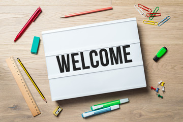 Wall Mural - welcome written on lightbox in office as flatlay