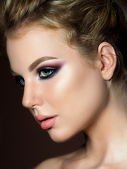 Beauty portrait of young woman evening makeup