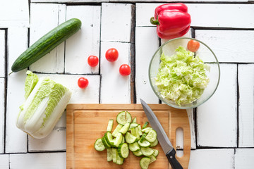 Wall Mural - Vegetables lie on a table on a chopping board