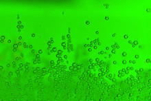 The Green Bubbles In Soda Water As A Texture.
