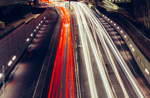 City light trails of fast moving traffic on road in London at night Poster Mural XXL