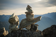 Close-up Of Cairn On Rocks Against Mountains