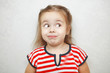 © Ilshat - Surprised little girl with arched eyebrows portrait photo