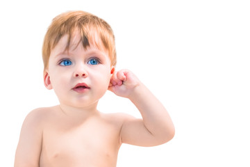 Lovely smiling blue-eyed baby holding an ear on a white background. Isolated