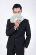 © kamonrat - Businessman holding money with a sly look.