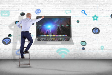 Sticker - Businessman in front of a wall with a computer surrounding by app and social icon - 3d render