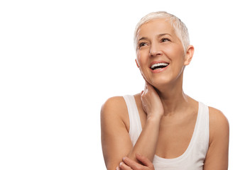 Portrait of a beautiful elderly woman, smiling, isolated on white background 