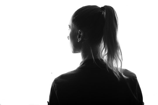 Fototapete - Female person silhouette,view from behind,back lit over white