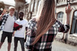 © Viacheslav Yakobchuk - Nice to see you. Delighted nice young woman looking at her friends and waving her hand while greeting them