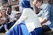 © Viacheslav Yakobchuk - Pleasant interaction. Positive cheerful happy students sitting together and talking to each other while enjoying their time together