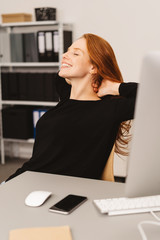 Wall Mural - Pretty young businesswoman de-stressing