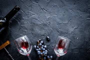 Wall Mural - bottle of red wine with glasses on texture background top view m