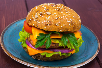 Wall Mural - Warm fresh burger with meat on plate